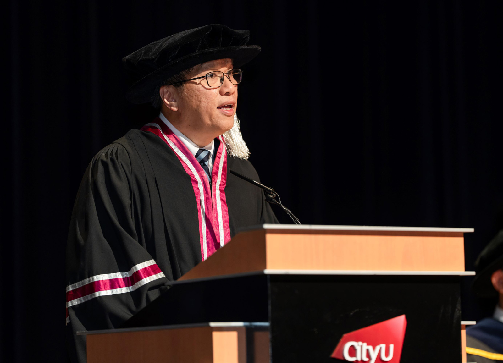 Dean Professor Kalok Chan addresses the 2024 College of Business Commencement