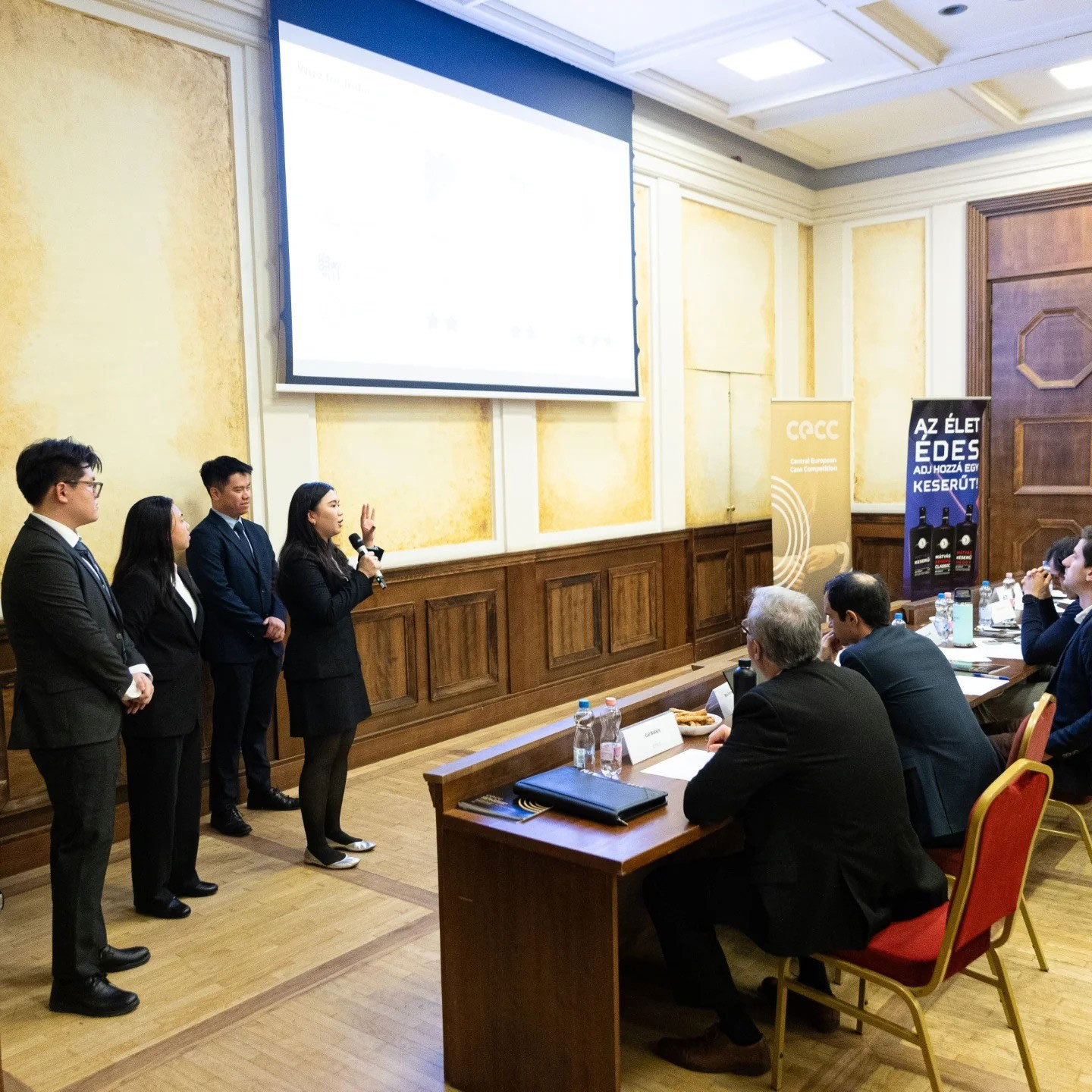 The team makes recommendations to the panel of judges, showcasing their strategic insights and innovative solutions.