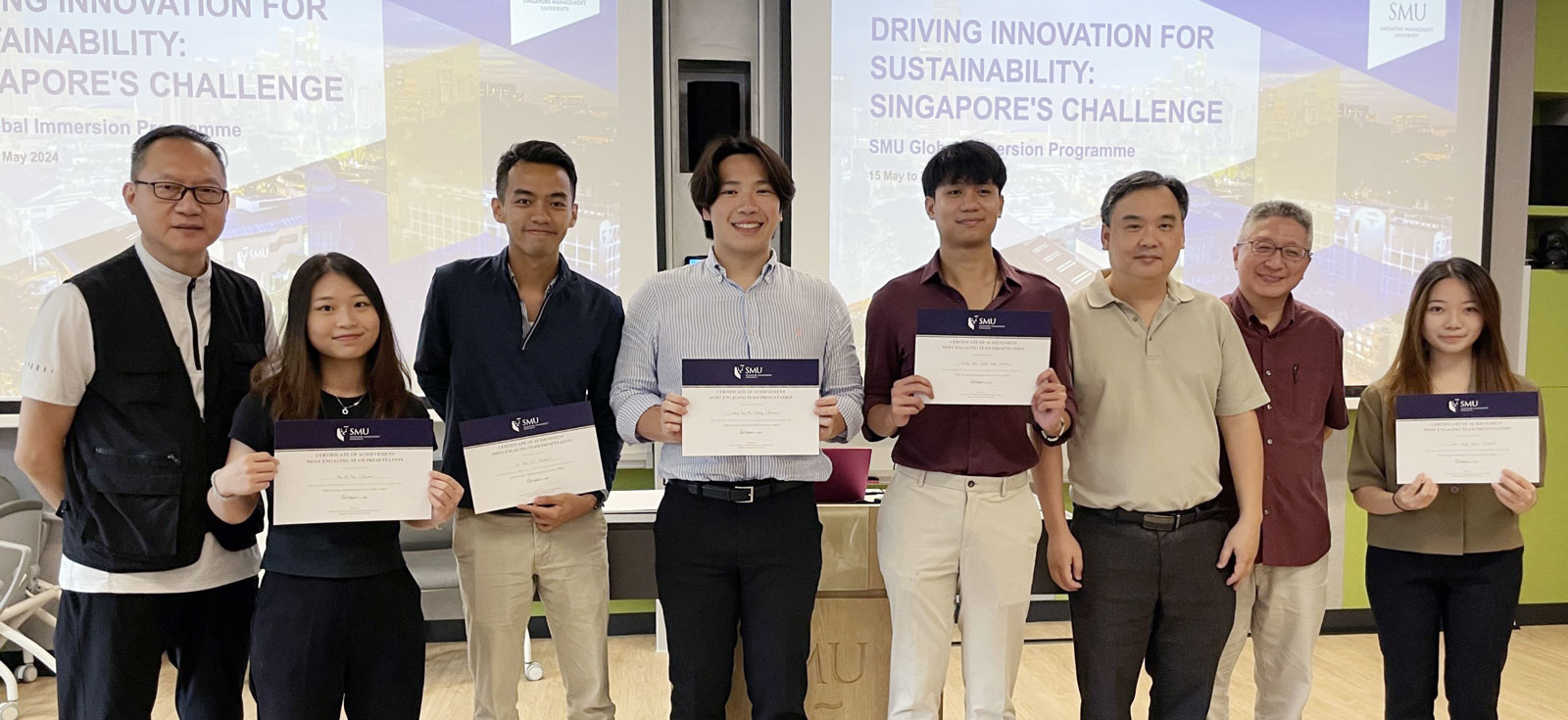 The judging panel and the Champion and Most Collaborative Team: (from left) Professor Michael Wong, Ho-yan Ma, Chun-fai Tse, Jeffrey Wong Koon-kiu, Hans Josef Tuble Velez, Professor Wei-thoo Yue, Professor Siew-ning Kan (SMU Instructor), Wing-ching Lam  