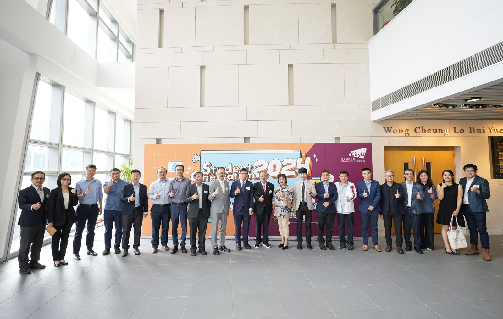 Dean Kalok Chan (10th from left) leads senior management and CB department heads, wishing freshmen a transformative and fruitful year at CityUHK.