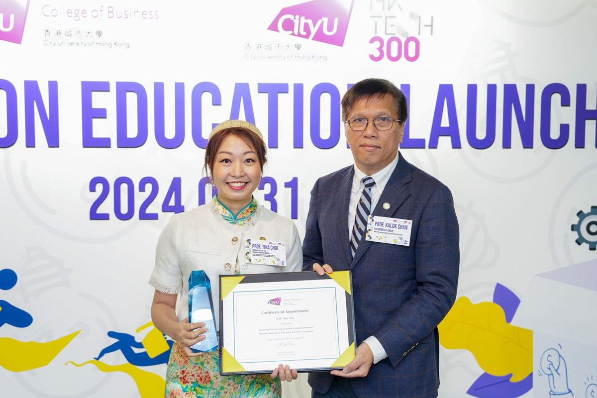 Professor Tina Choi (left), Founding Director and Founding Committee Member of BIE, introduces BIE