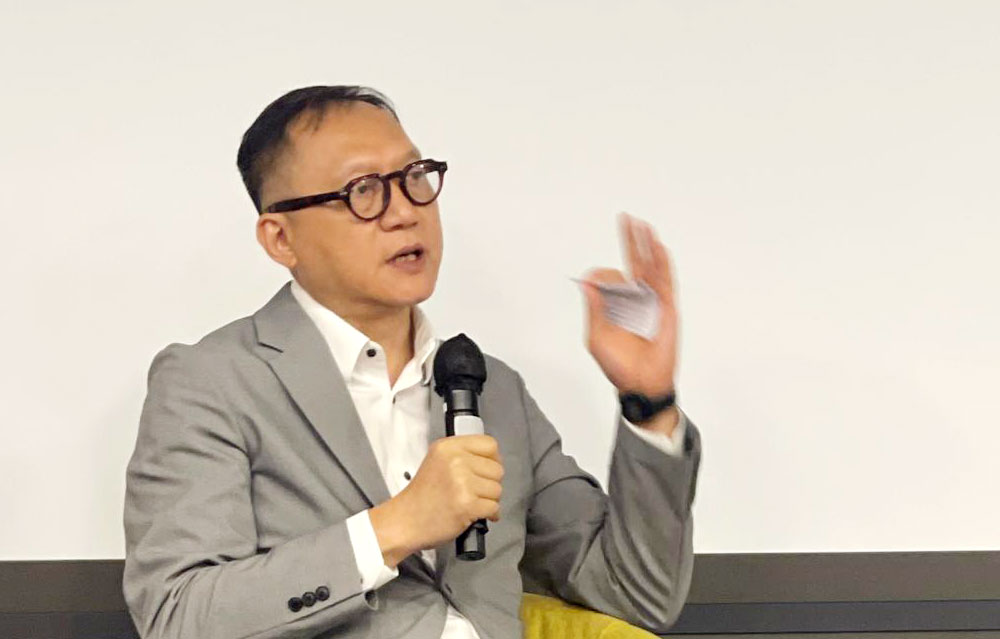 Professor Michael Wong moderates the discussion on unlocking enterprise potential.