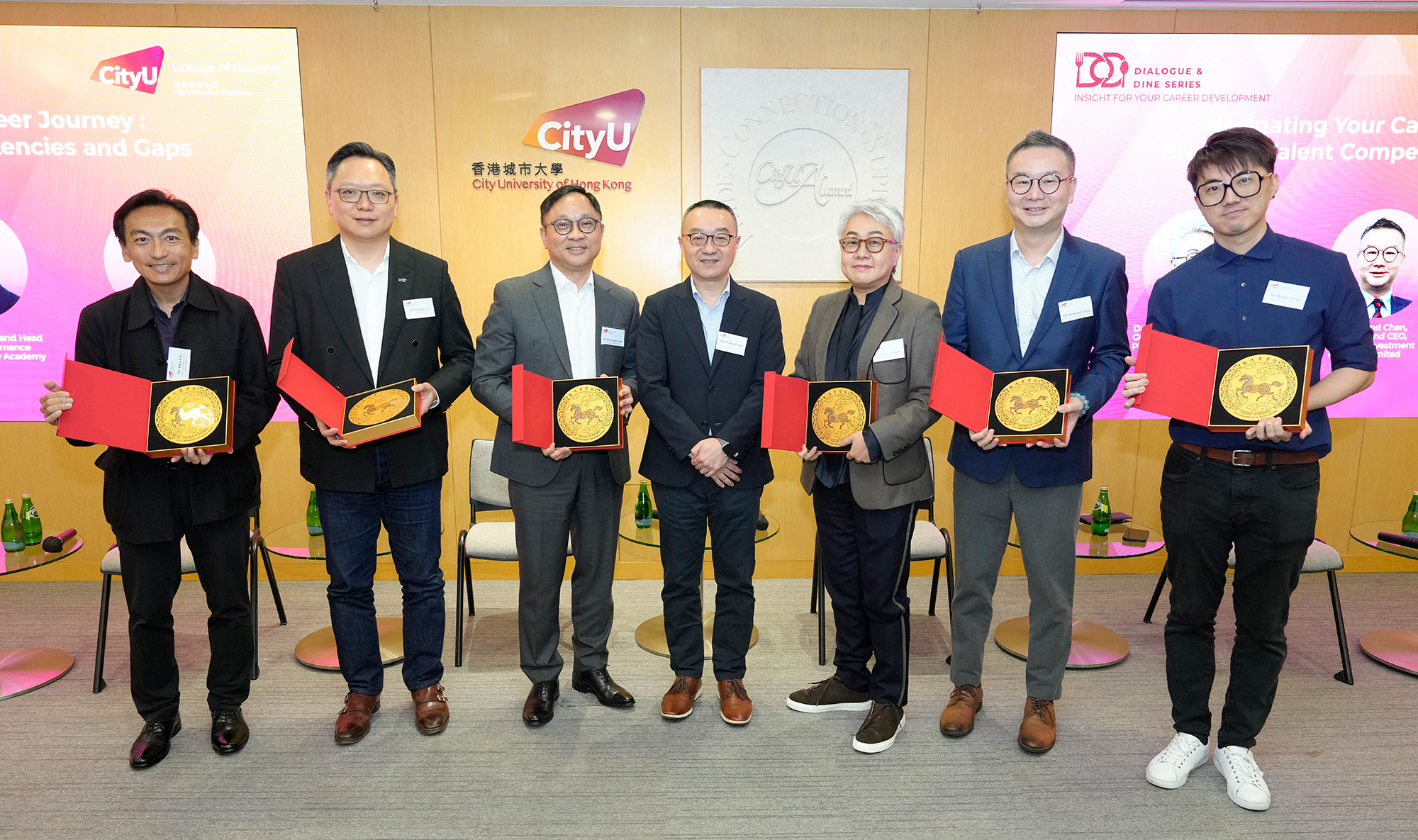 Mr William Mak (centre), Chairman of the Student Development Sub-committee of the CAAB, presents the souvenirs to the speakers as an appreciation for their inspirational sharing.