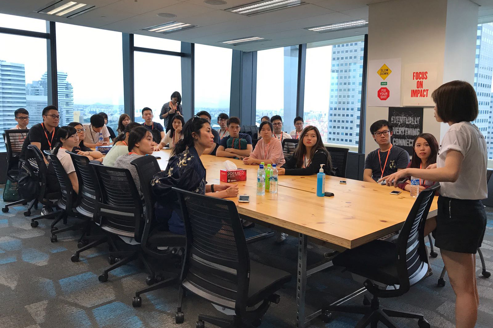 A real City University of Hong Kong marketing workshop with a presenter and participants around a table