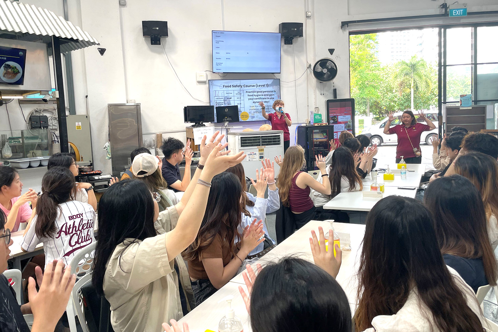 Students learn Singapore Sign Language to order food at Dignity Kitchen.