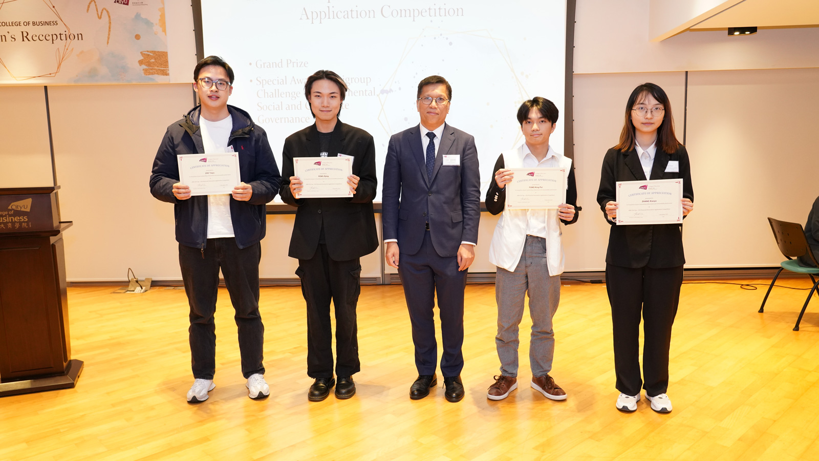 Dean Kalok Chan (middle) presents certificates of appreciation to (from left) Zhe Taiyu (BBA GBSM), Feng Zijing (BSc CFFT), Fung King-pui (BSc CFFT), Zhang Xiaoya (BSc CFFT) for winning the 18th Citi Cup - Citi Financial Innovation Application Competition
